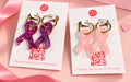 Créoles Octobre Rose en résine – ruban rose